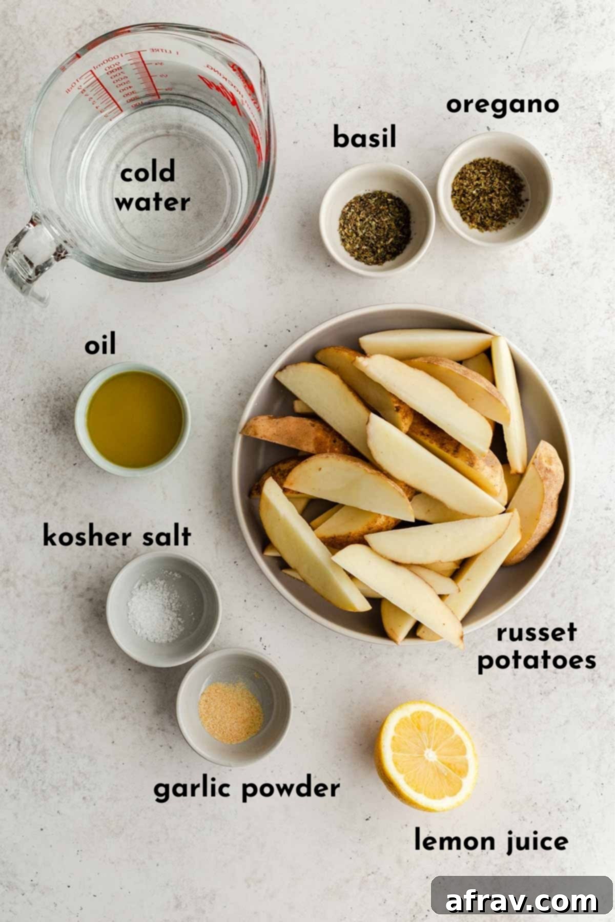 Ingredients to make wedge fries arranged individually and labelled.