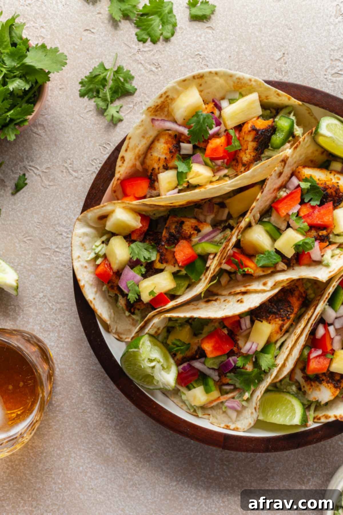 Crispy Air Fryer Fish Tacos 6 Air fryer fish tacos arranged on a serving tray.