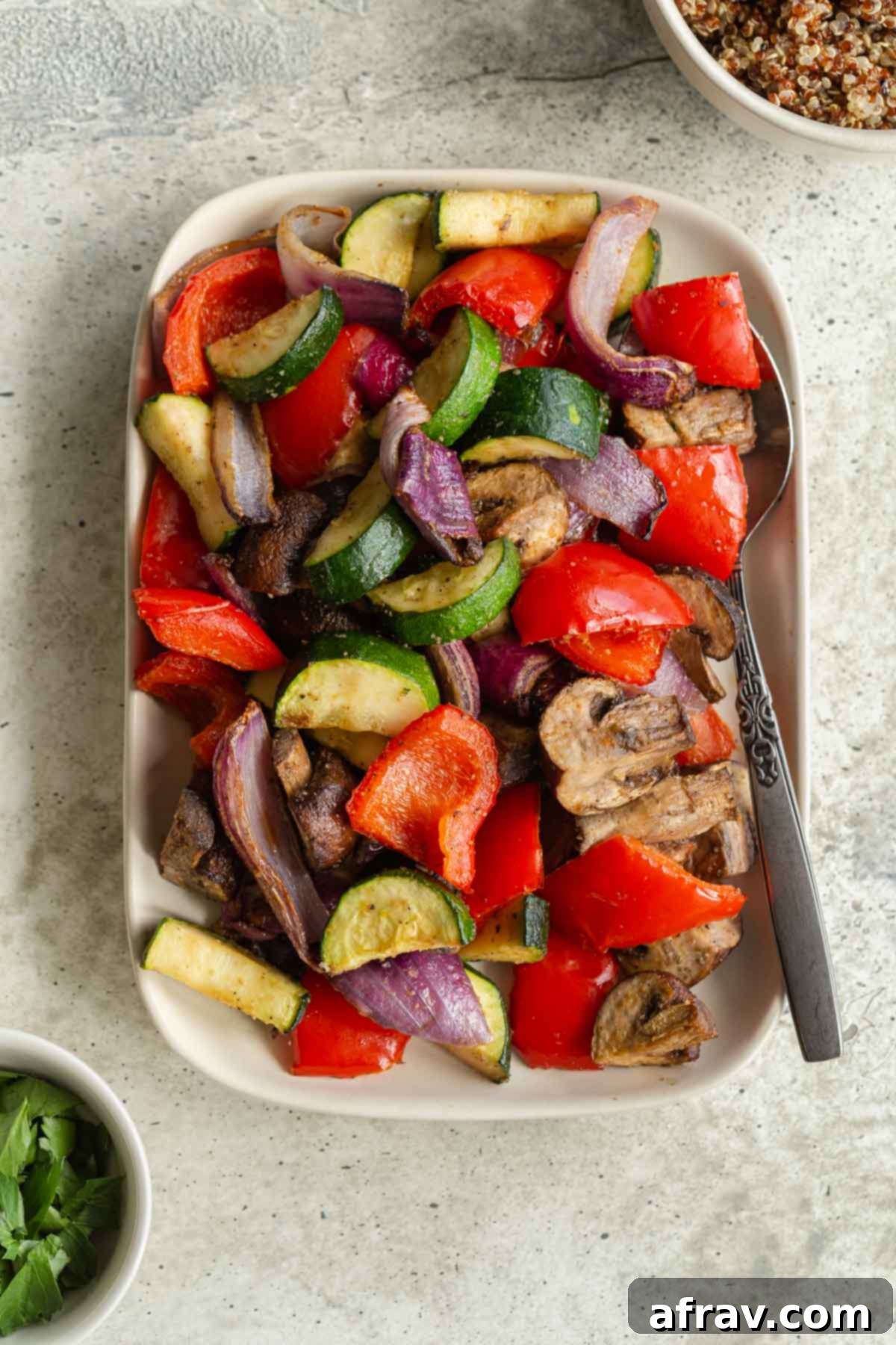Crispy Air Fryer Veggies 2 Roasted vegetables on a plate with a spoon.