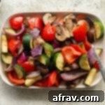 Crispy Air Fryer Veggies 8 Overhead view of air fryer vegetables on a rectangular plate.