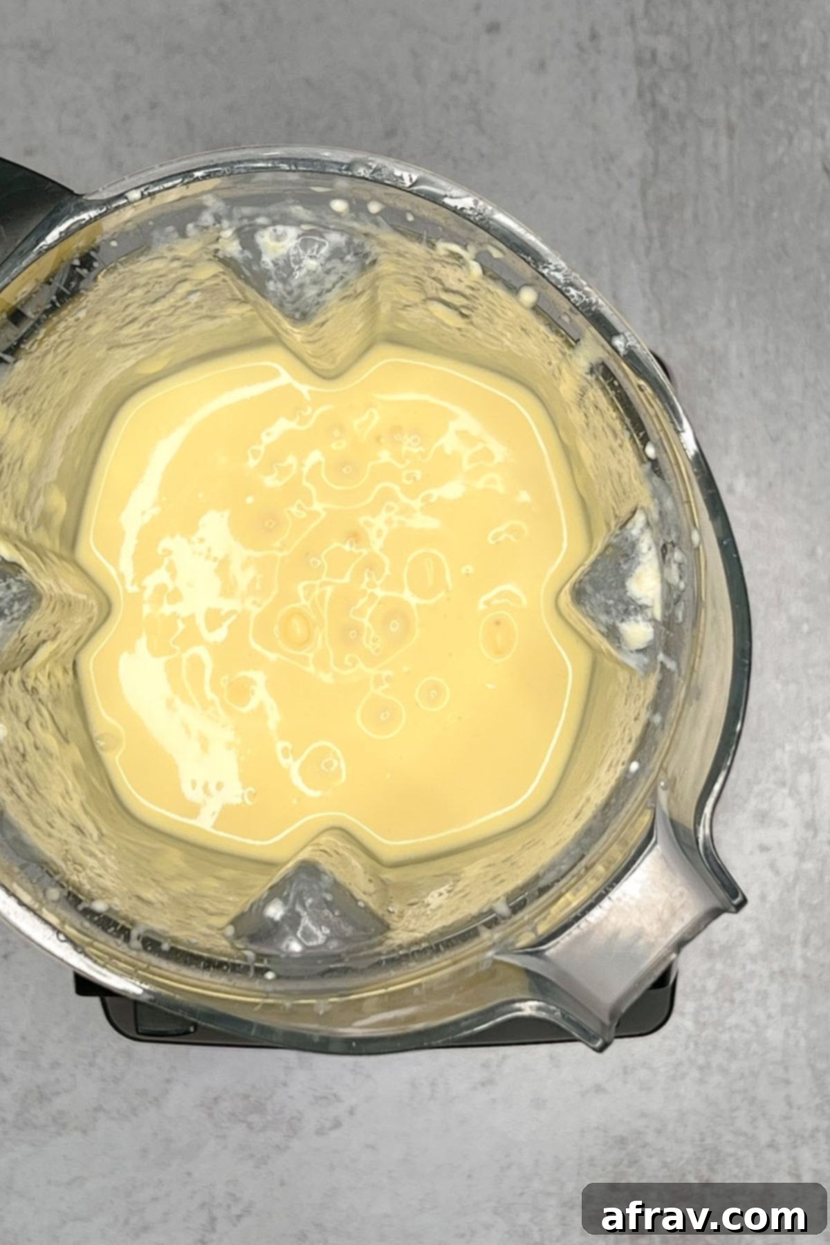 Tropical Mango Pineapple Blend 5 Overview view of mango pineapple smoothie in a blender.