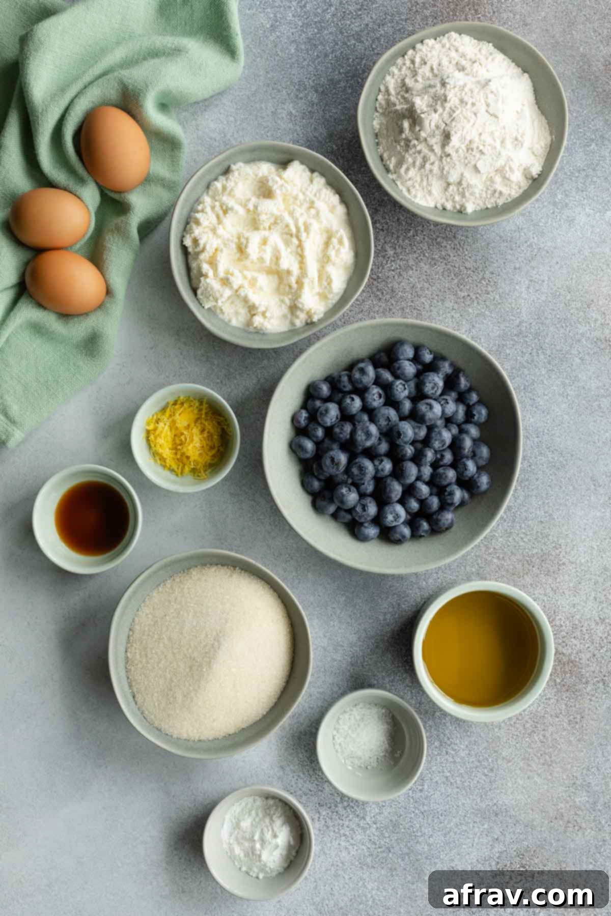 Ingredients to make blueberry cake arranged individually for easy viewing.
