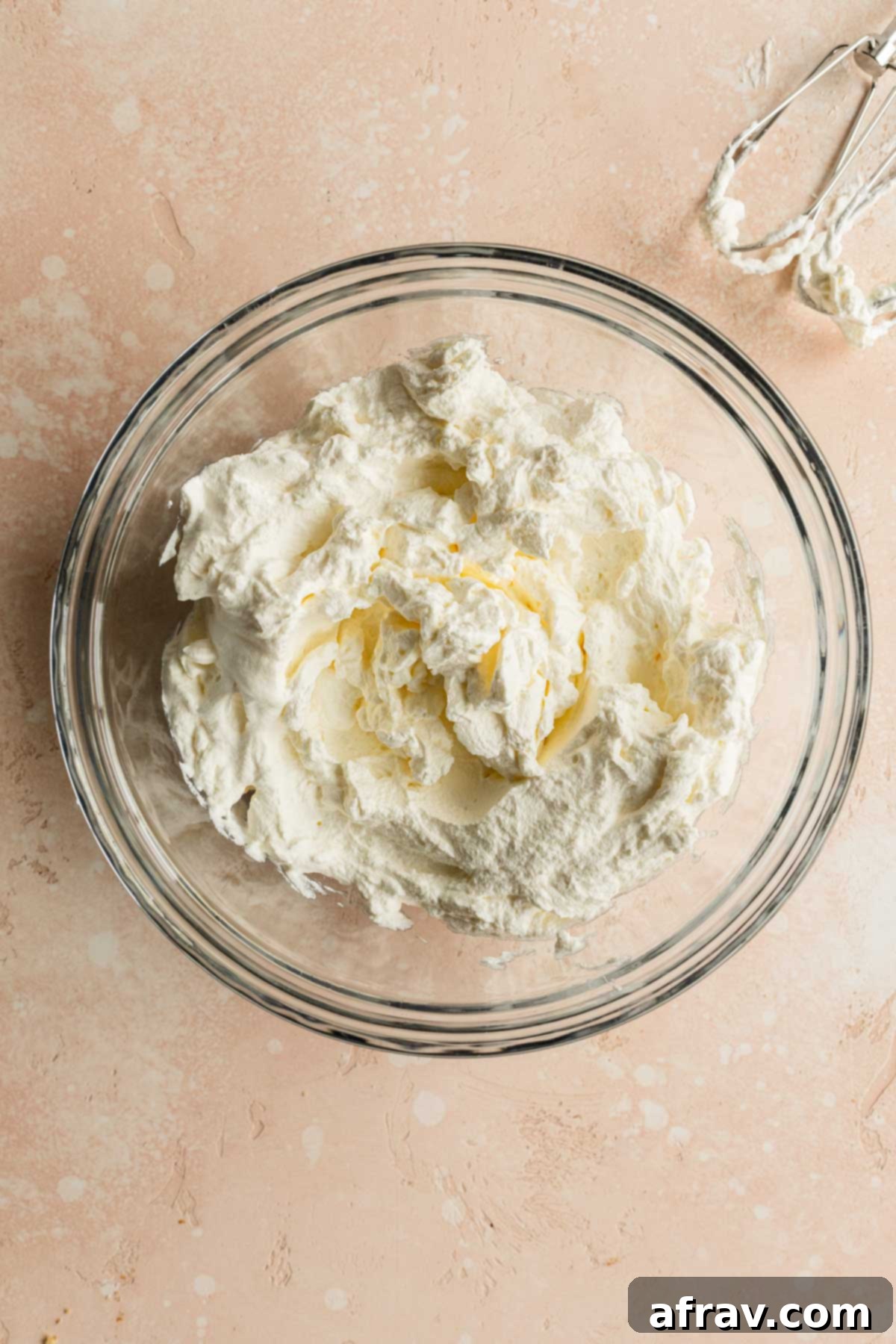 Whipped cream in a glass bowl.