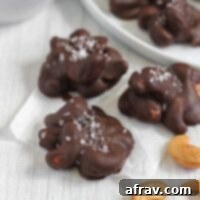 Three chocolate covered cashew clusters topped with sea salt.