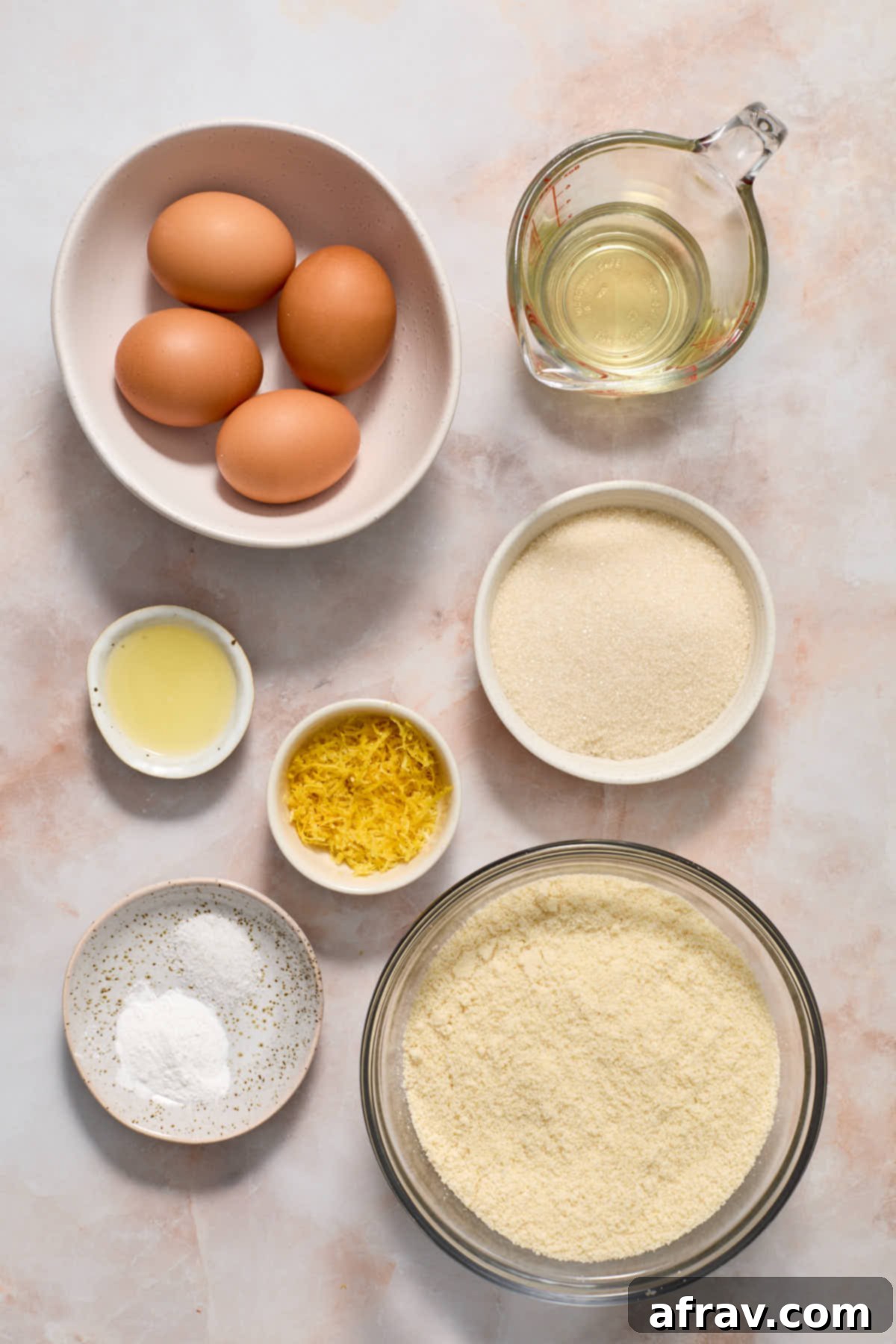 Ingredients to make almond flour lemon cake arranged in individual dishes.