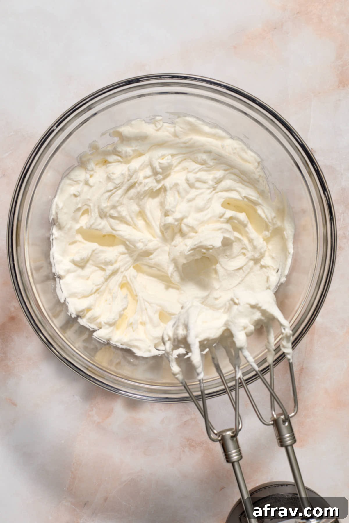 Whipped topping in glass bowl.