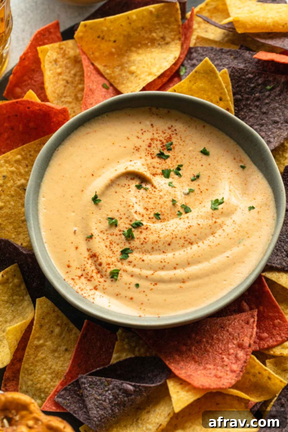 Creamy Vegan Chipotle Dip in a bowl, surrounded by crispy tortilla chips, ready to be served.