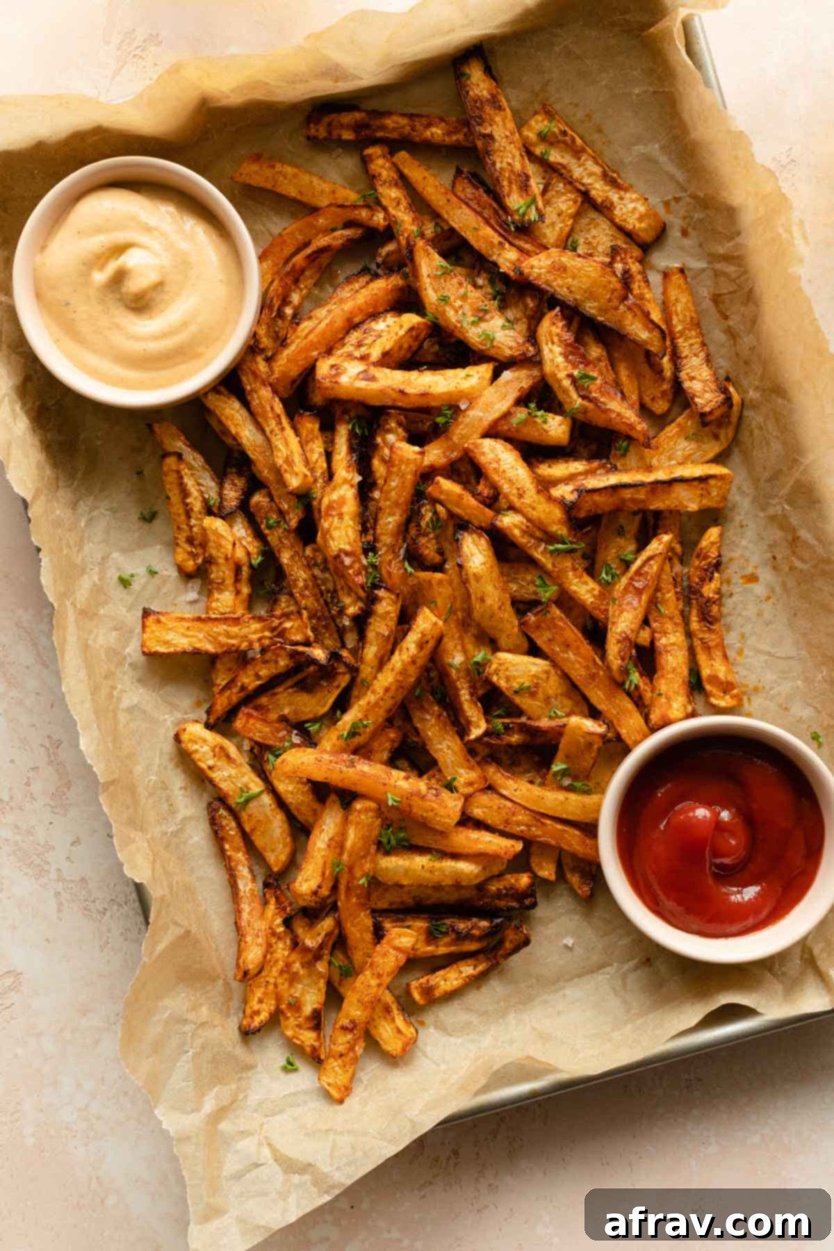 Turnip fries served on a tray with some dips.
