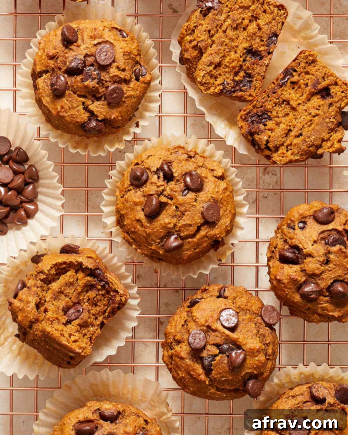 Pumpkin banana muffins arranged on a wire cooling rack.