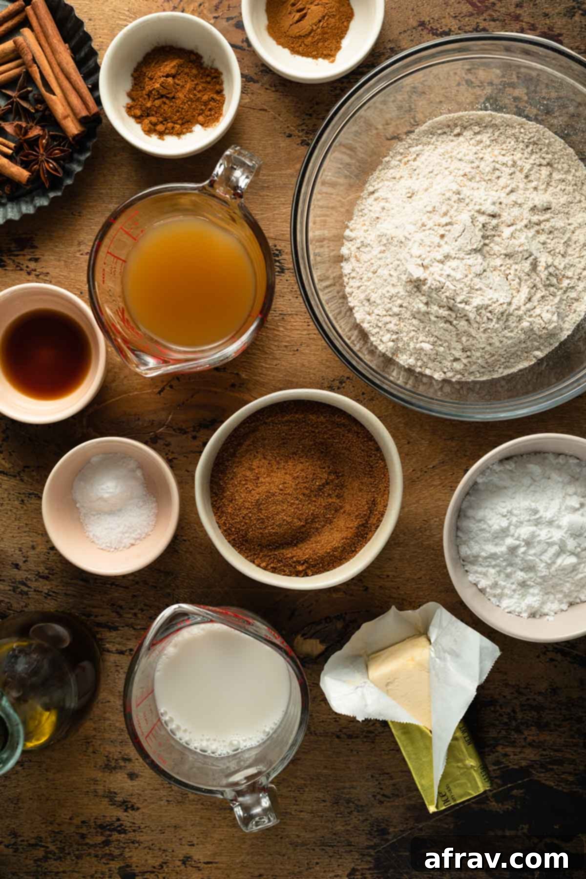 Individual bowls containing ingredients to make apple spice cake, arranged neatly for preparation.