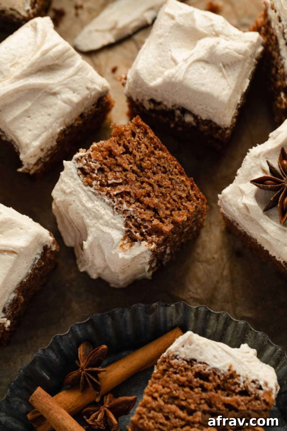 A slice of apple spice cake turned on its side, revealing its moist and tender crumb texture.