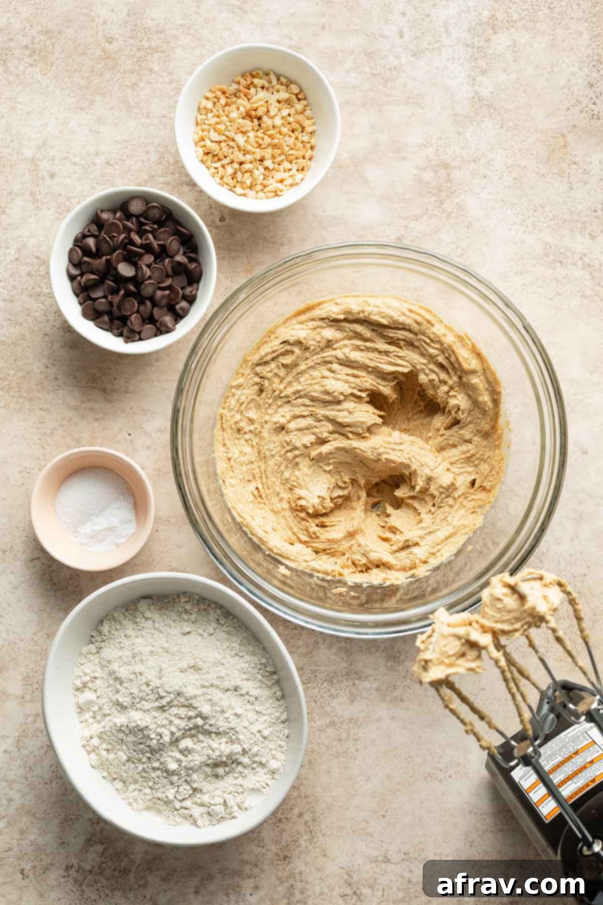 Wet ingredients creamed together in a glass bowl, showing a light and fluffy texture, ready for dry ingredients.