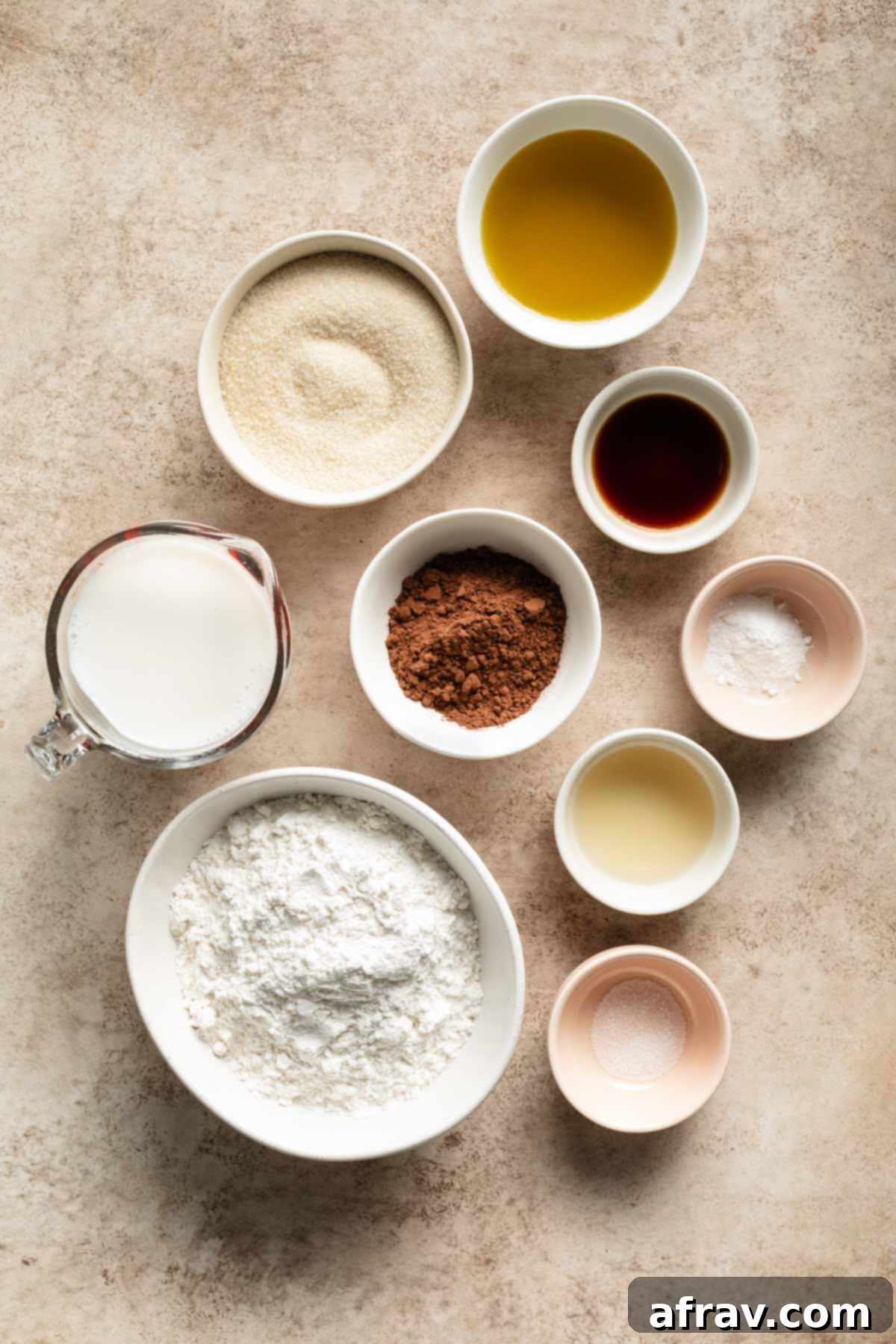 Ingredients to make air fryer cake arranged in individual bowls.