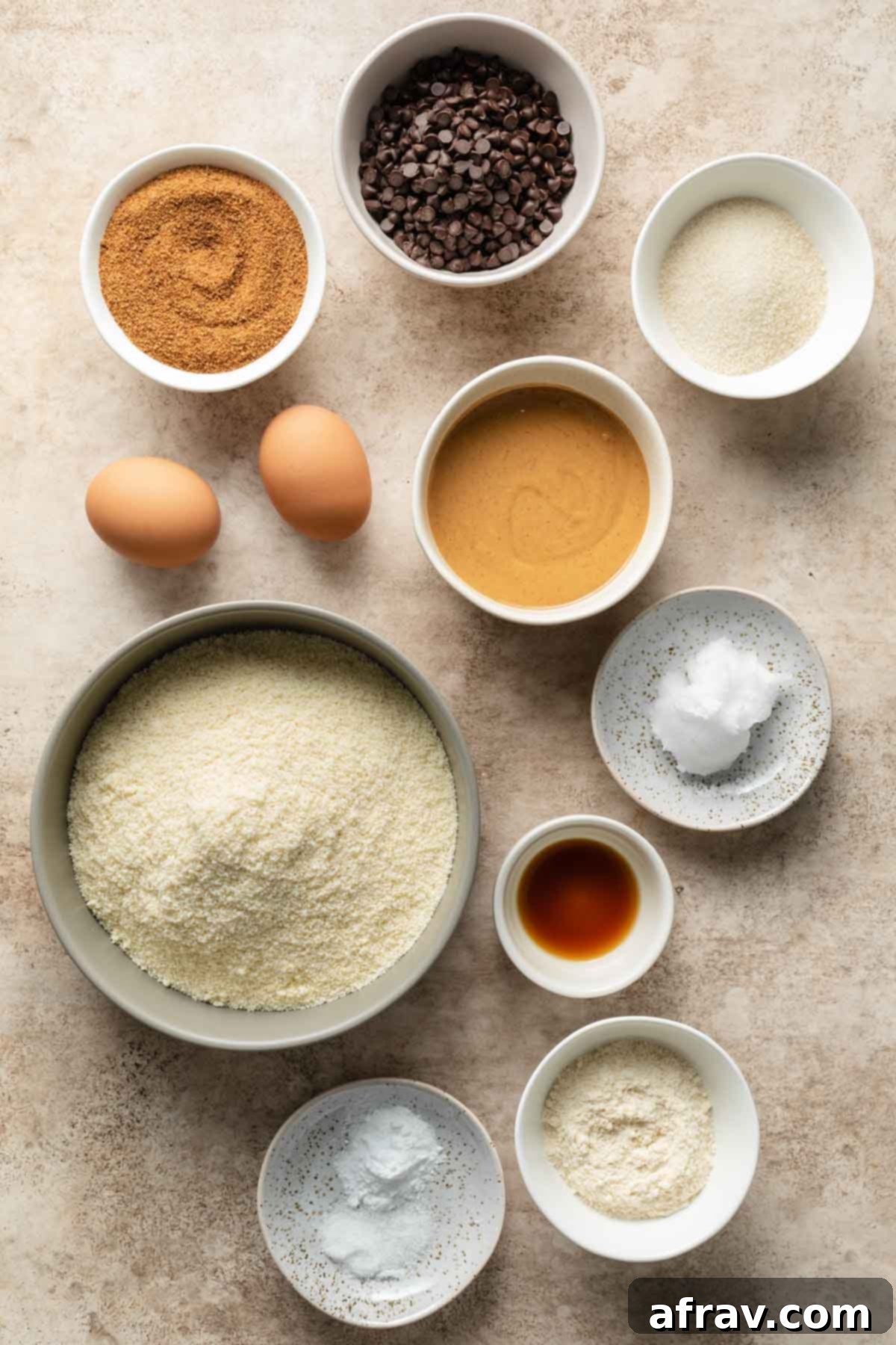 Ingredients to make almond flour peanut butter cookies arranged individually.