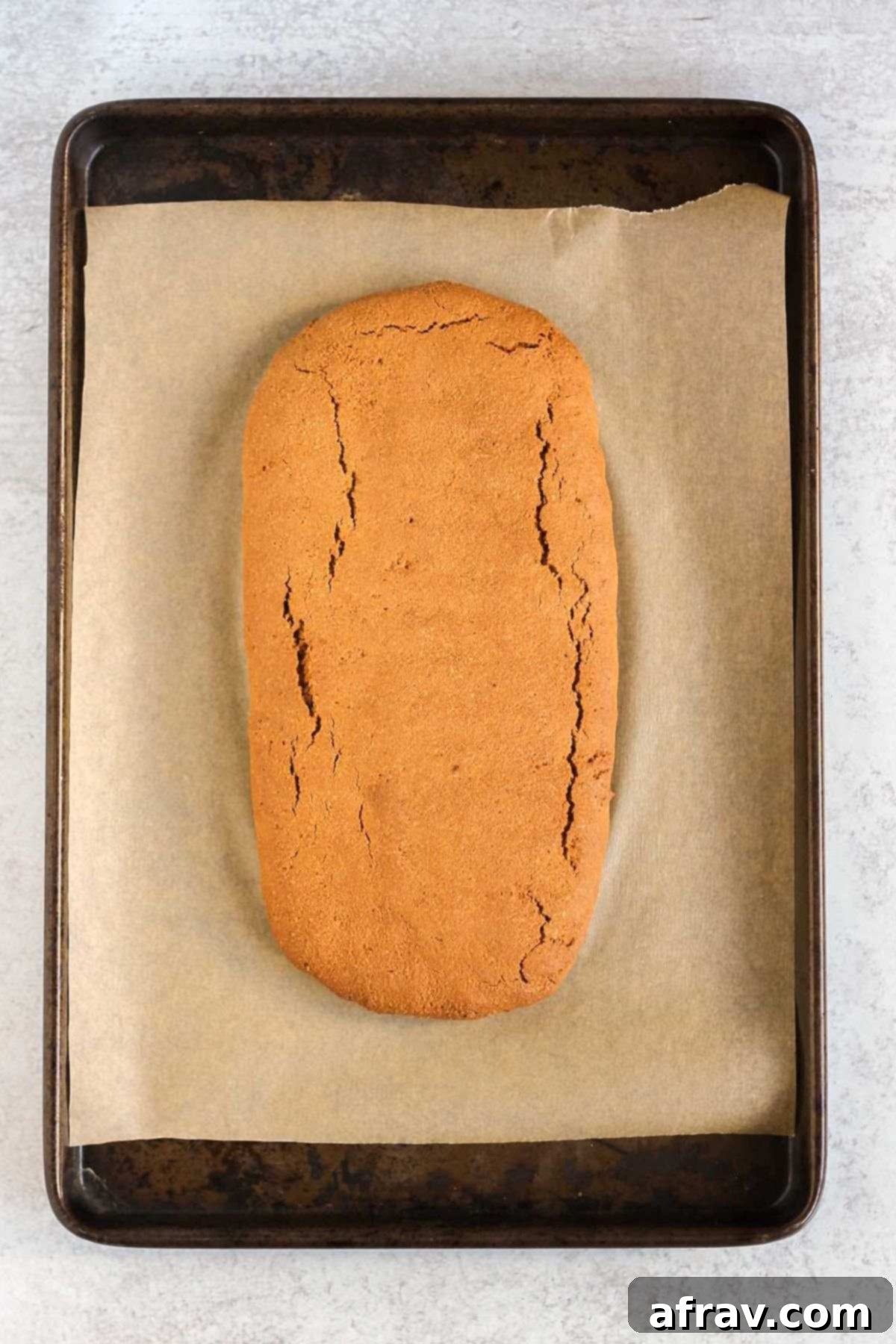 Baked biscotti log before being cut into slices.