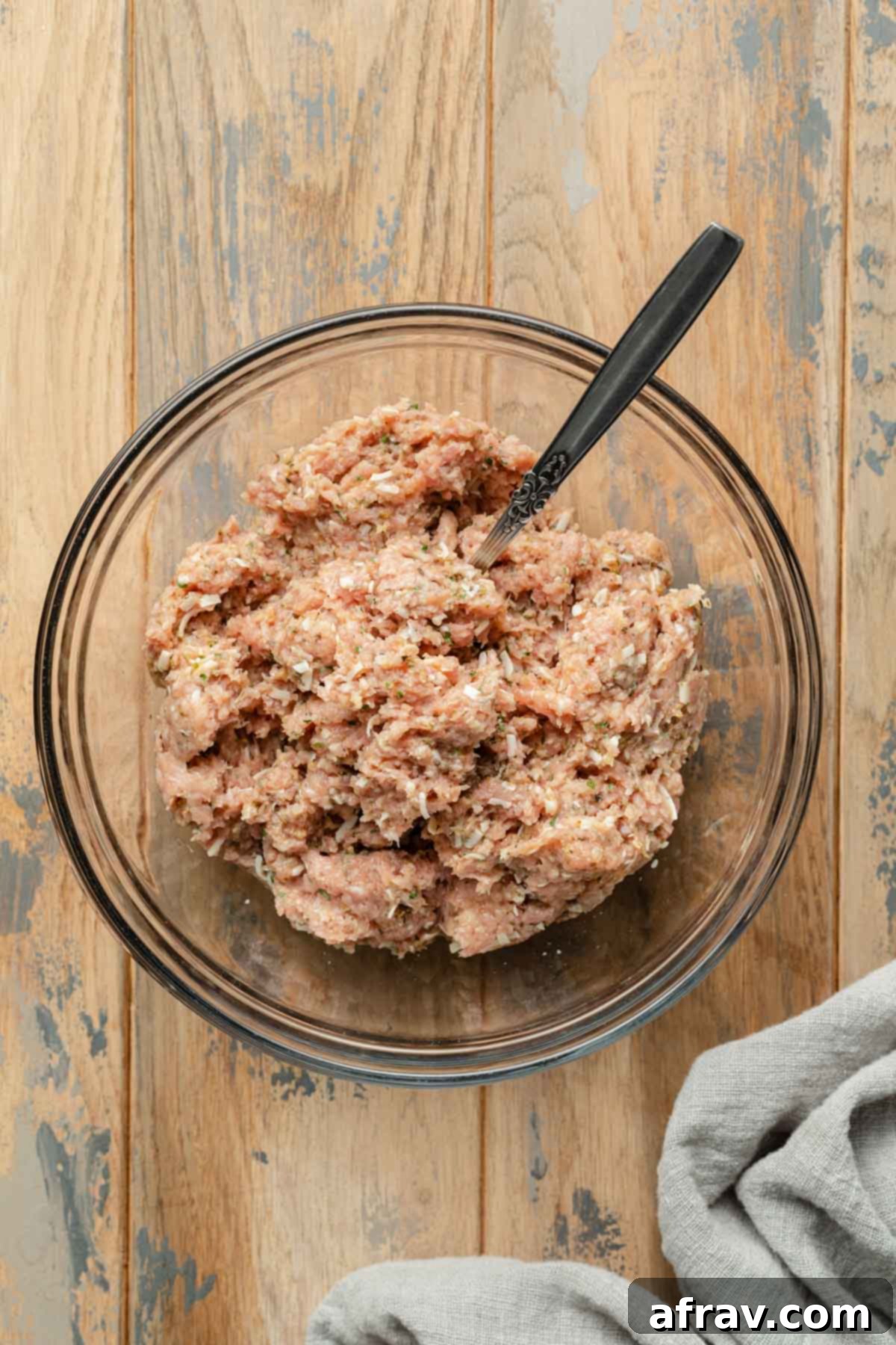 Turkey meatball mixture in a glass bowl.