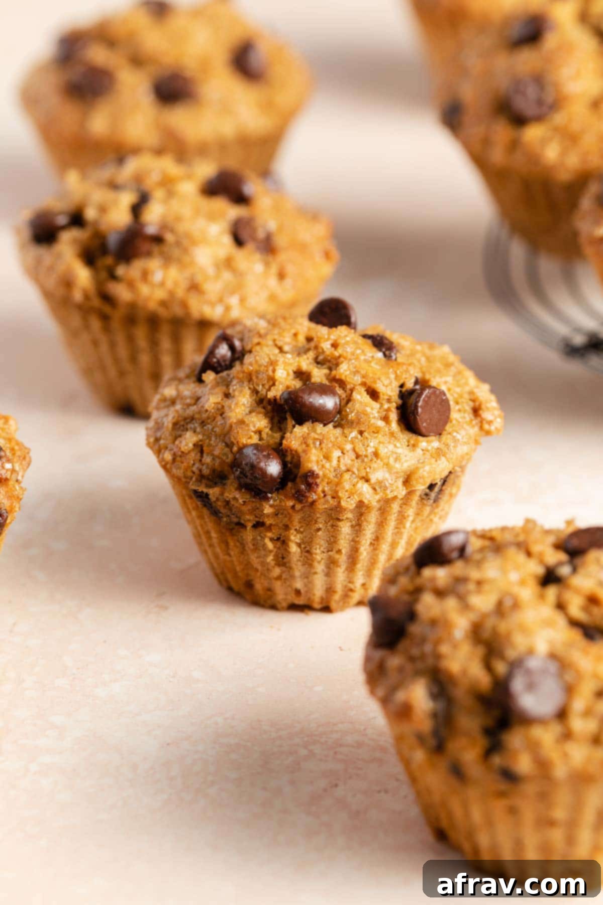 Side view of air fryer chocolate chip muffins.