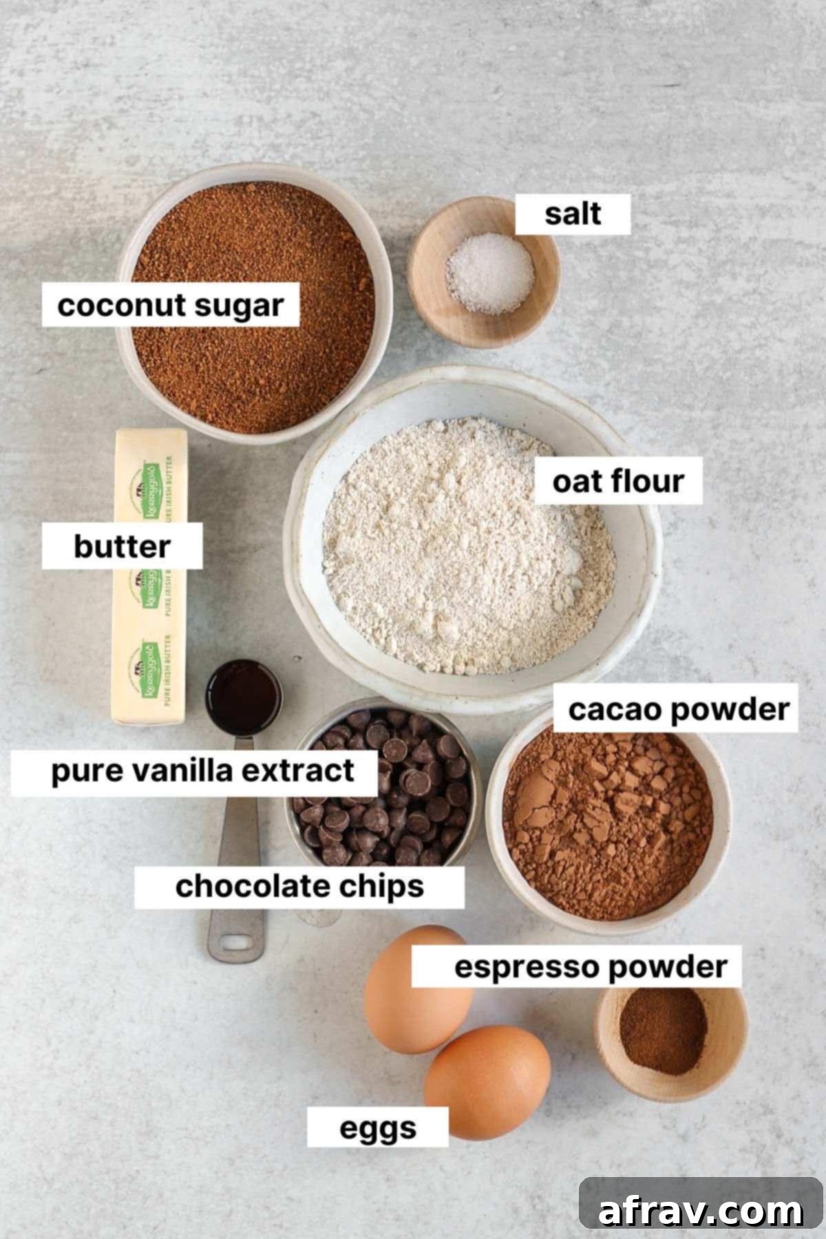 Arrangement of labeled ingredients for making delicious oat flour brownies on a countertop.