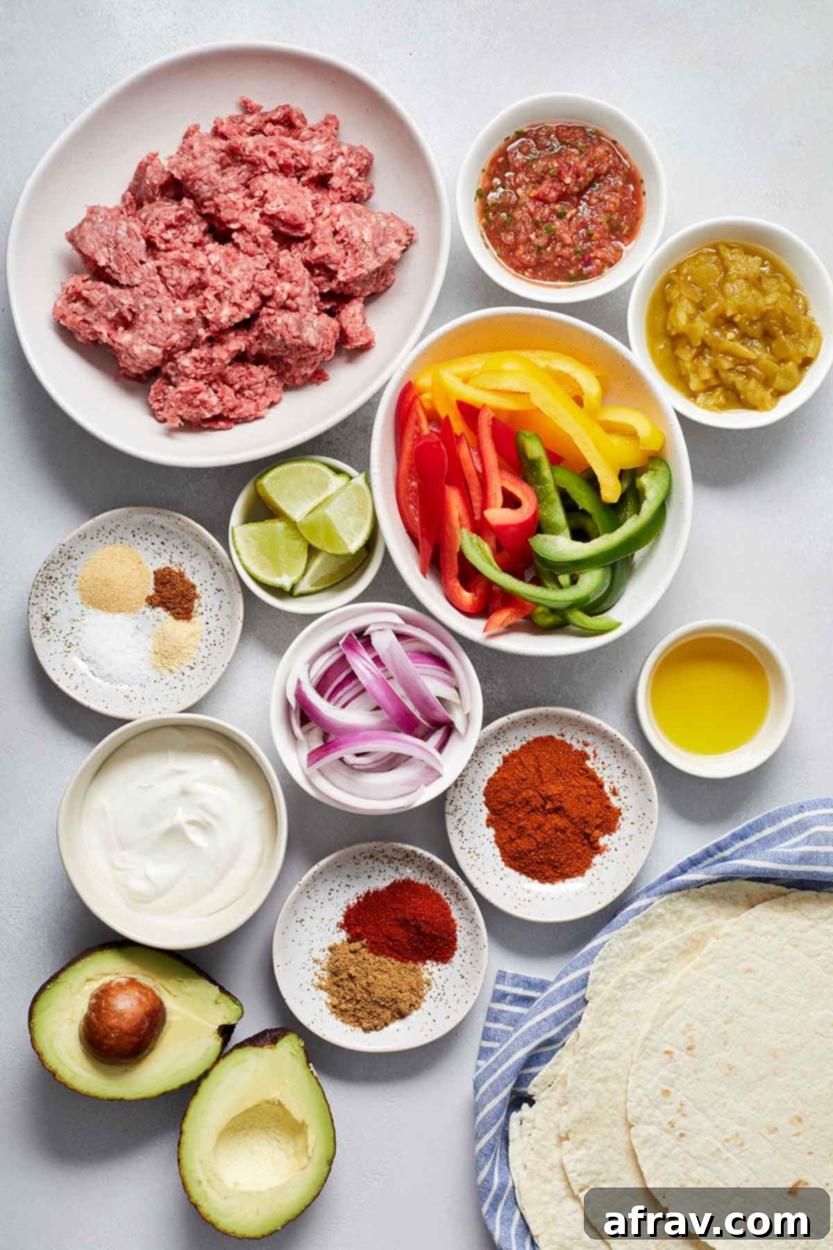 Zesty Ground Beef Fajitas 3 Ingredients to make ground beef fajitas arranged in individual dishes.