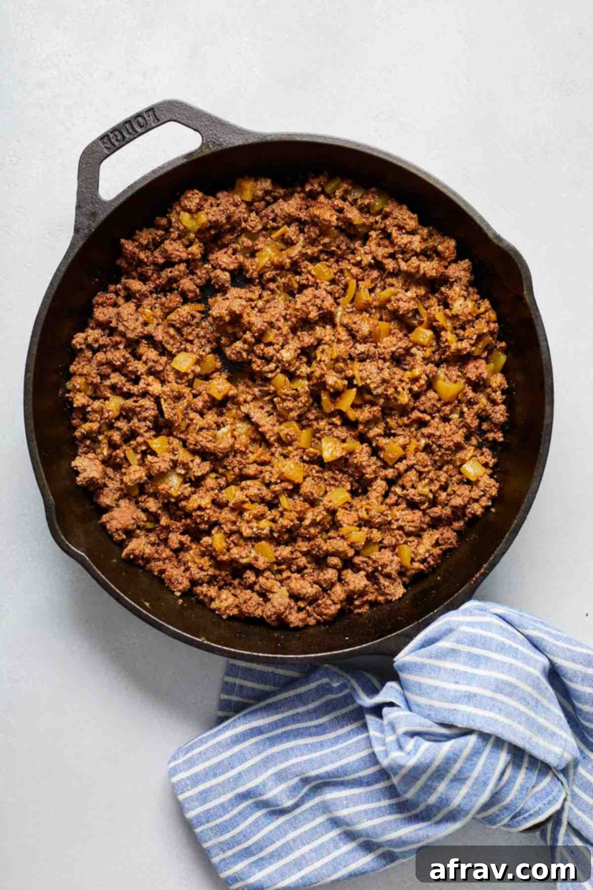 Zesty Ground Beef Fajitas 4 Ground beef mixture for fajitas in a black cast iron skillet.