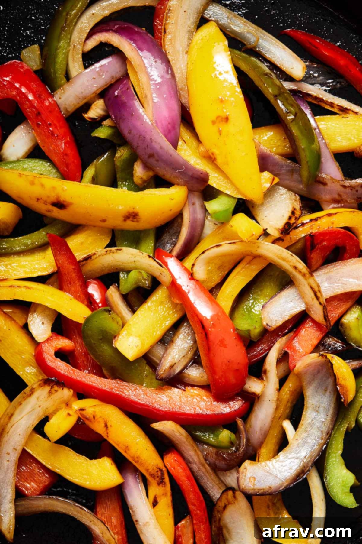 Zesty Ground Beef Fajitas 5 Close up view of sautéed peppers and onions.