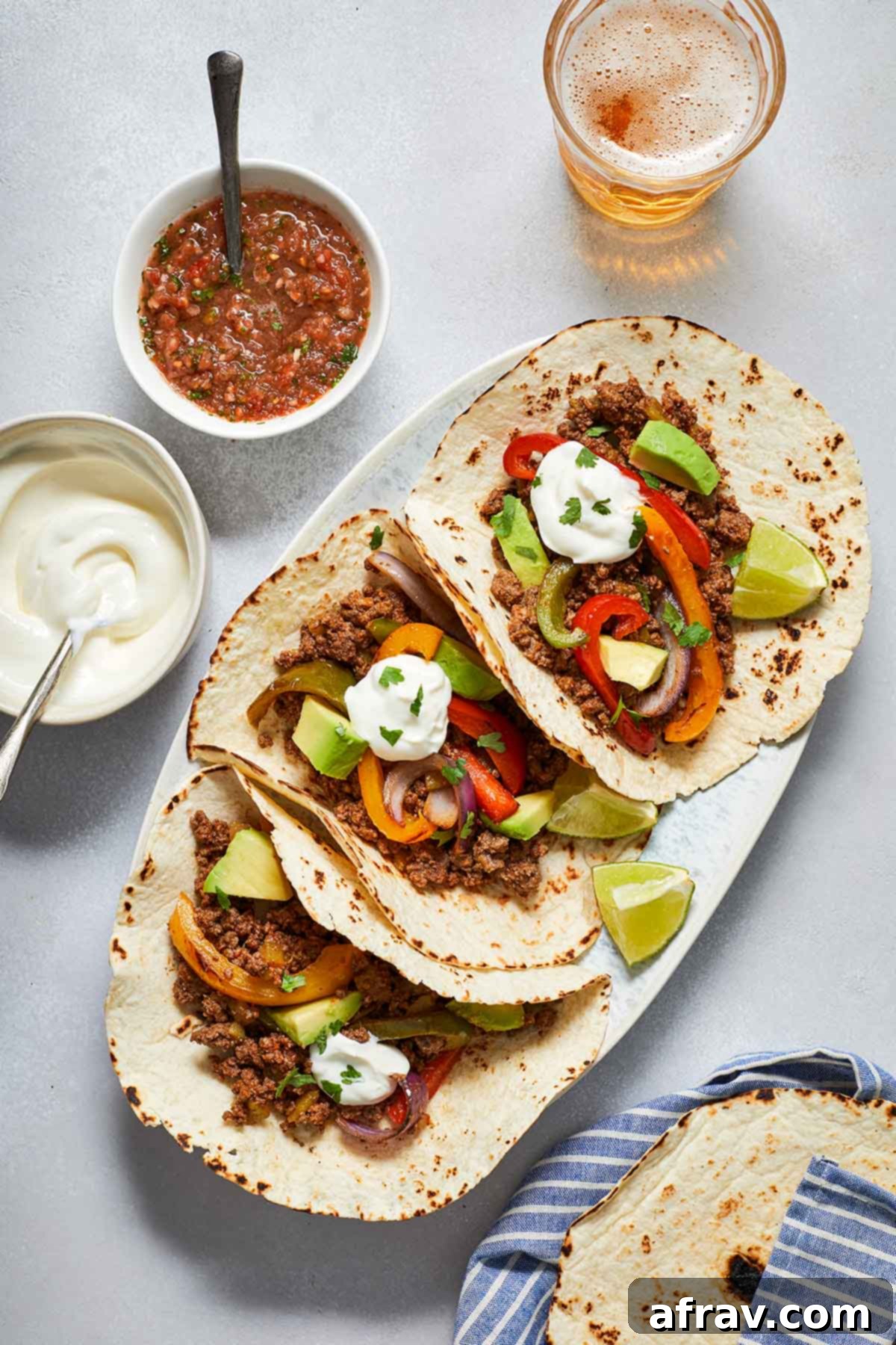 Zesty Ground Beef Fajitas 7 Overhead view of assembled fajitas on a platter.