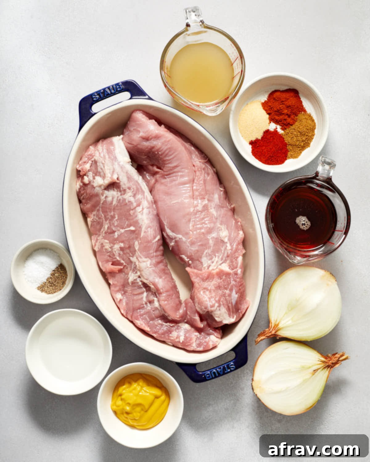 Ingredients for slow cooker pulled pork tenderloin, including spices, maple syrup, mustard, and broth.