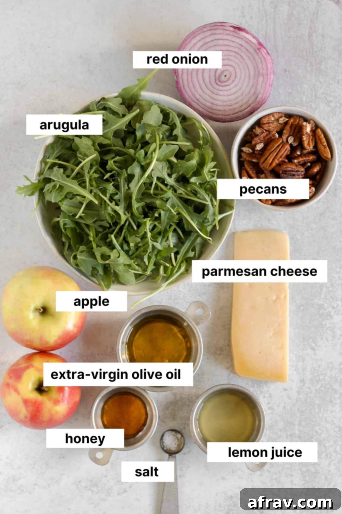 Labeled ingredients for arugula apple salad.