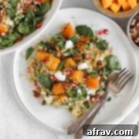 Harvest Quinoa Power Bowl 12 Single serving of fall quinoa salad with roasted butternut squash on a small white plate with 2 vintage forks.