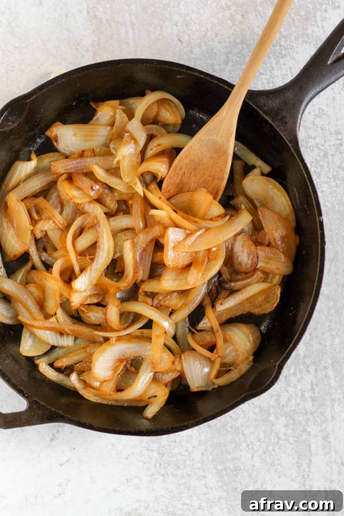 Sauteed onions in a cast iron skillet.