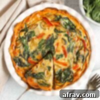 Sweet potato crust quiche with one slice cut and being served from the pie dish.