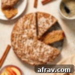 Delightful Almond Apple Cake 16 Almond flour apple cake cut into some slices with a piece on the side along with coffee and apple slices.