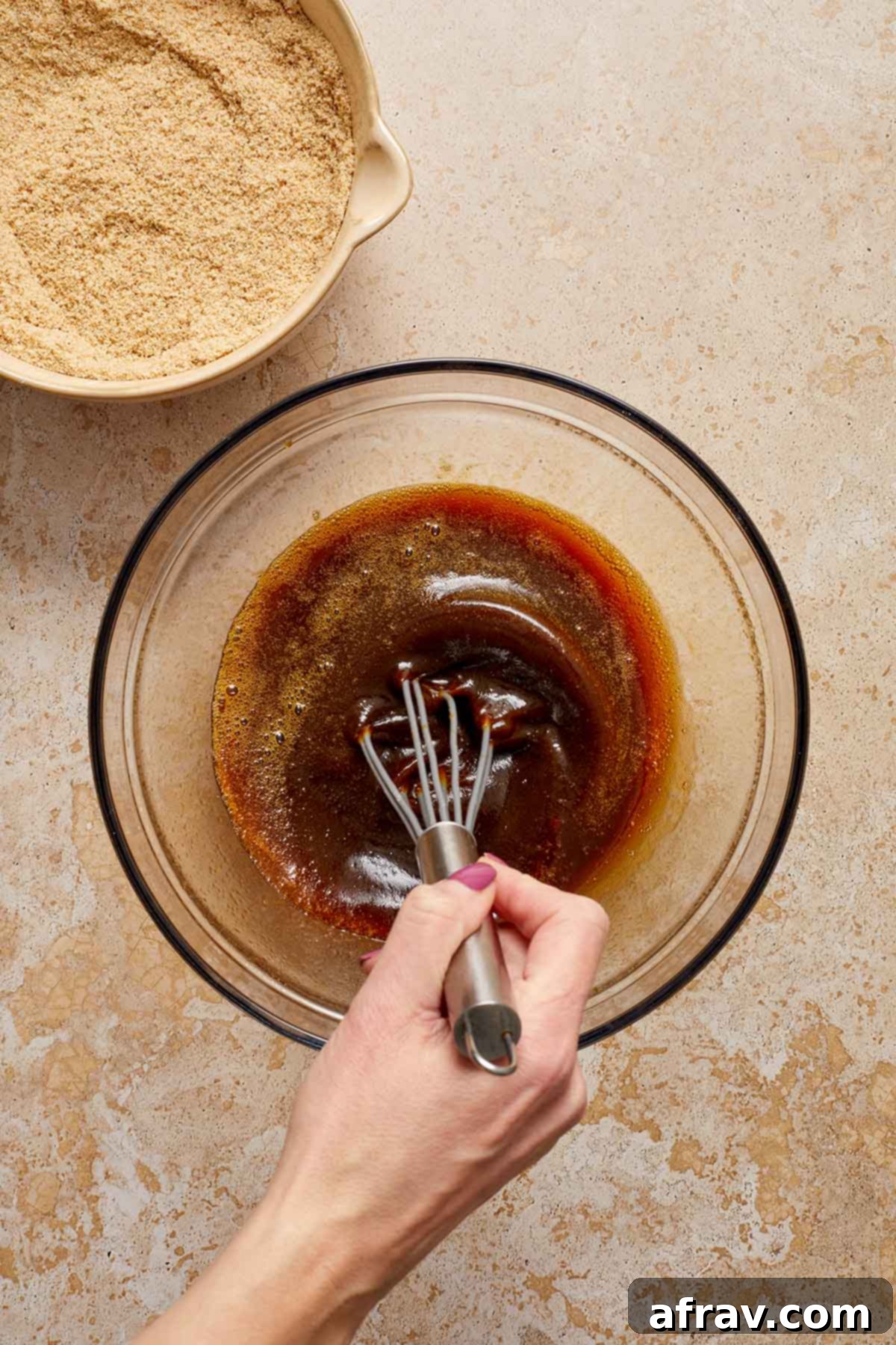 Moist Almond Flour Gingerbread Cake 5 Wet ingredients being whisked together in a glass bowl.