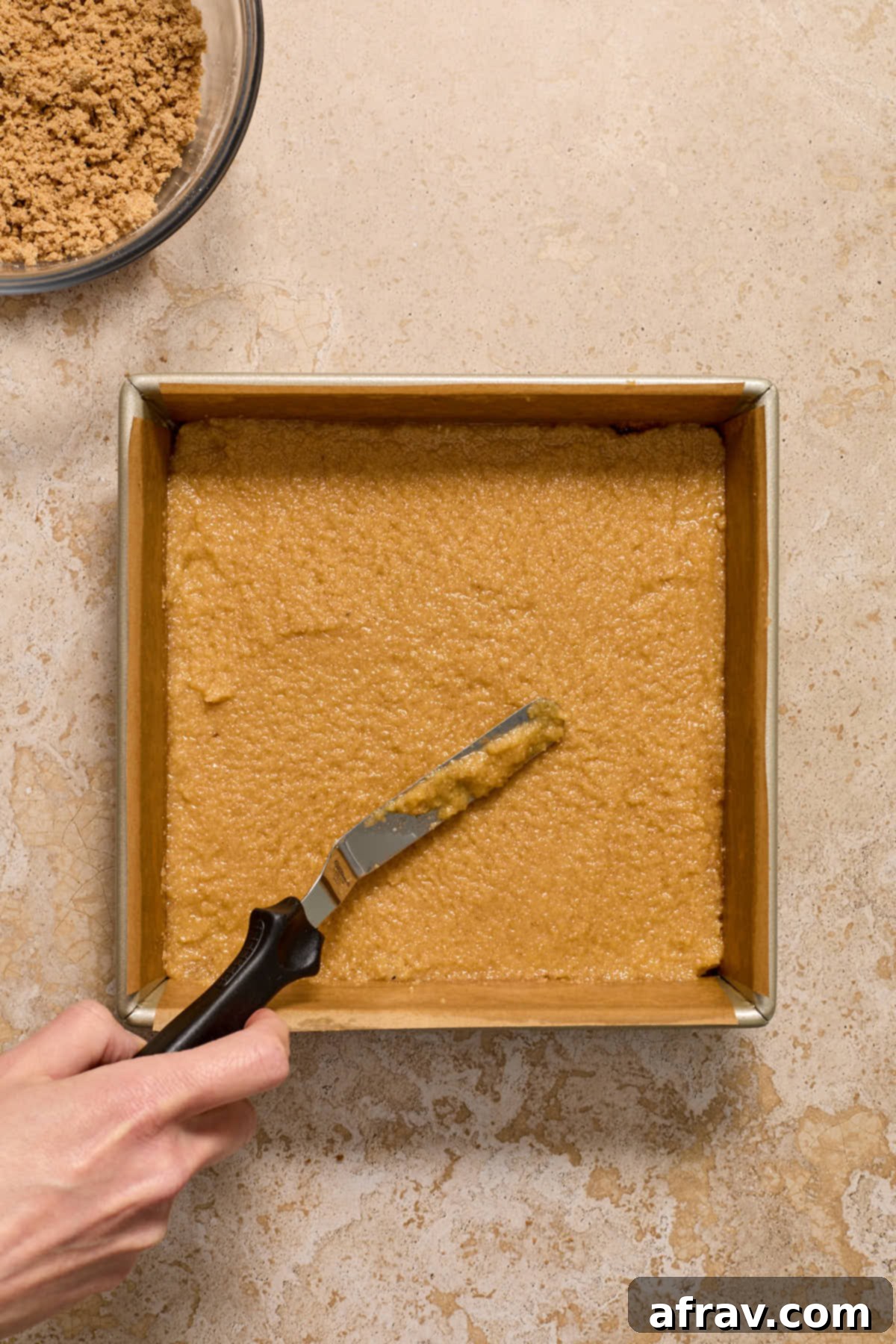 Second layer of coffee cake batter carefully spread on top of the cinnamon sugar layer in a square pan.