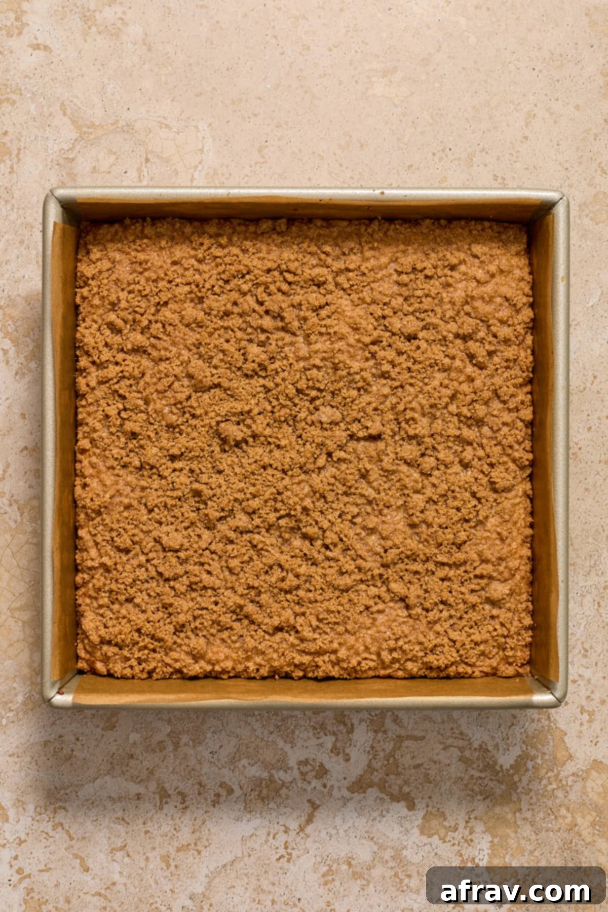 Perfectly baked almond flour coffee cake in a square pan, golden brown with a crisp streusel topping.
