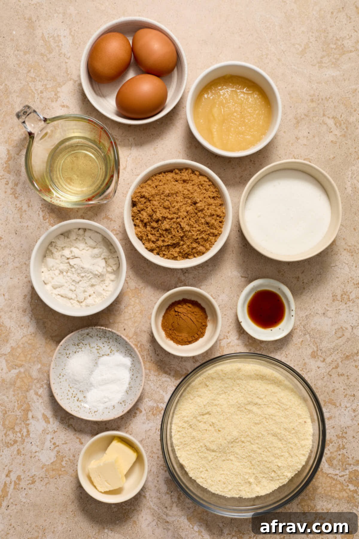 Arrangement of almond flour coffee cake ingredients in small individual bowls, ready for mixing.