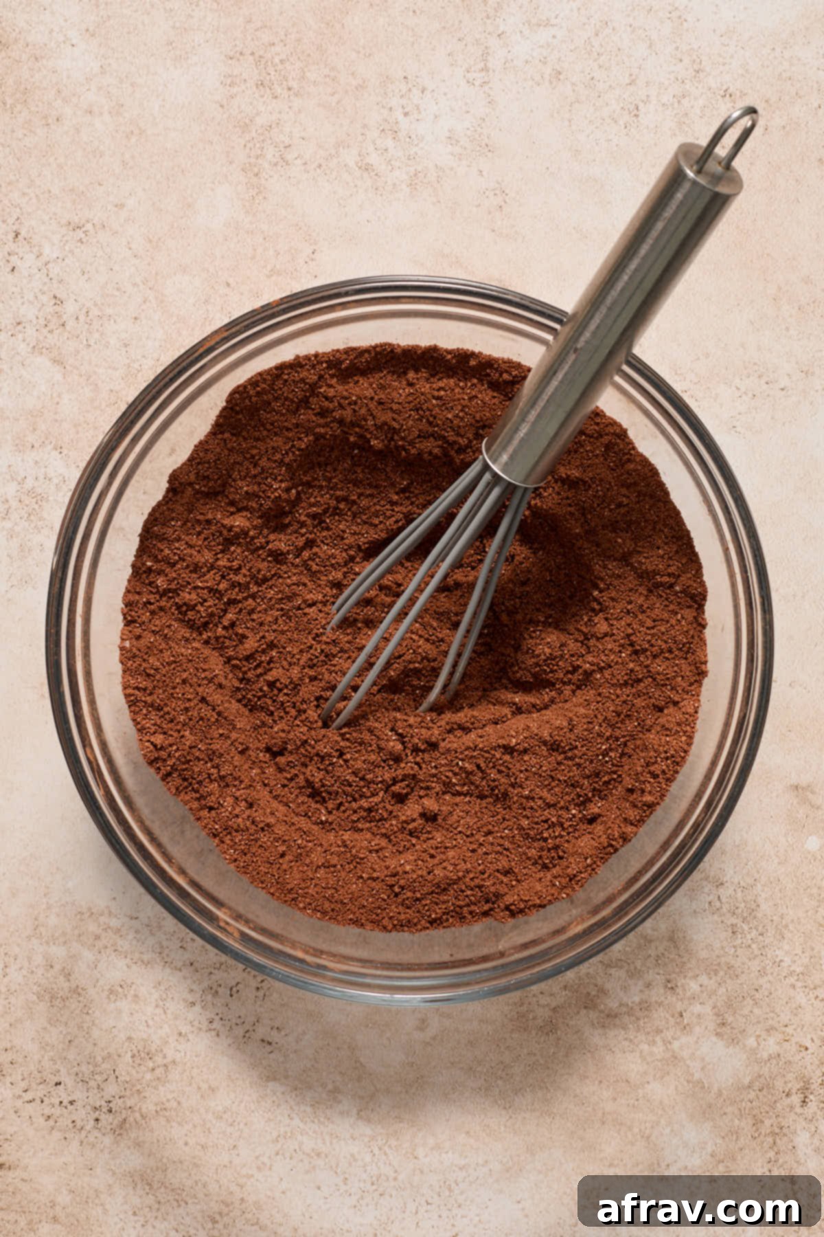Gluten-Free Almond Flour Chocolate Cupcakes 5 Dry ingredients for almond flour chocolate cupcakes whisked together in a glass bowl.