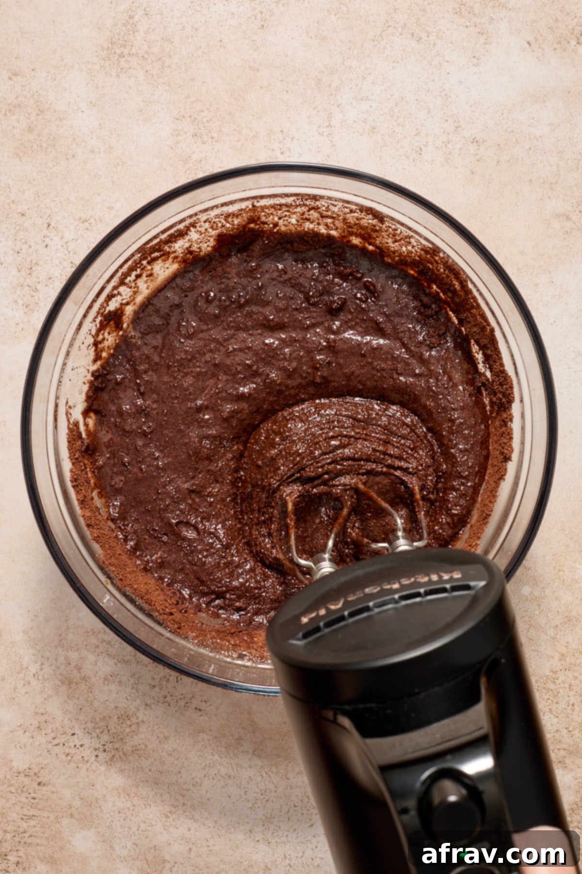 Gluten-Free Almond Flour Chocolate Cupcakes 8 Chocolate cupcake batter mixed together in a bowl, showing a smooth, cohesive texture.