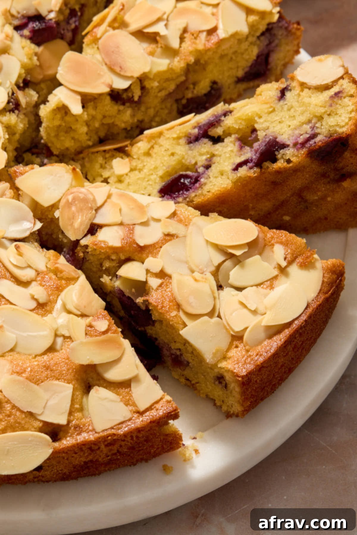 Close up of the almond topping on a slice of cake.