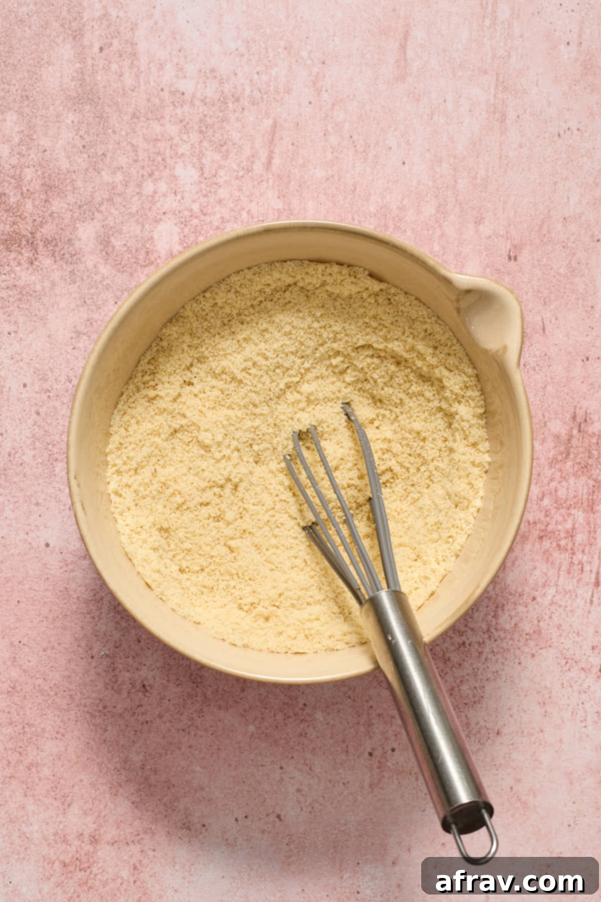 Dry ingredients: almond flour, baking soda, and salt, whisked together in a bowl.