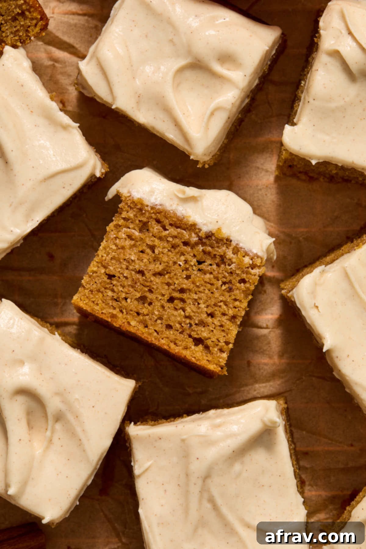 Spiced Almond Flour Pumpkin Cake 13 Several slices of gluten-free almond flour pumpkin cake arranged on parchment paper.