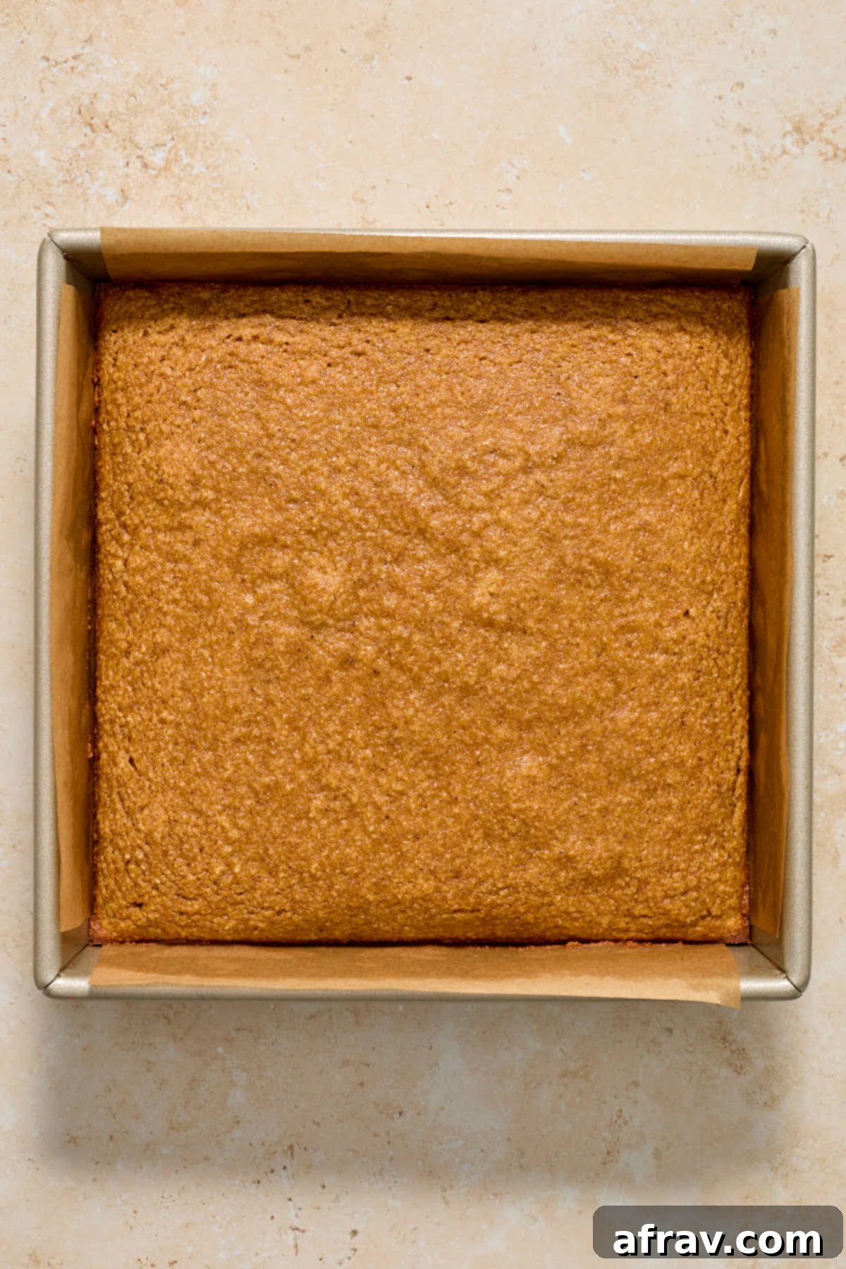 Spiced Almond Flour Pumpkin Cake 10 Baked almond flour pumpkin cake cooling in the pan.