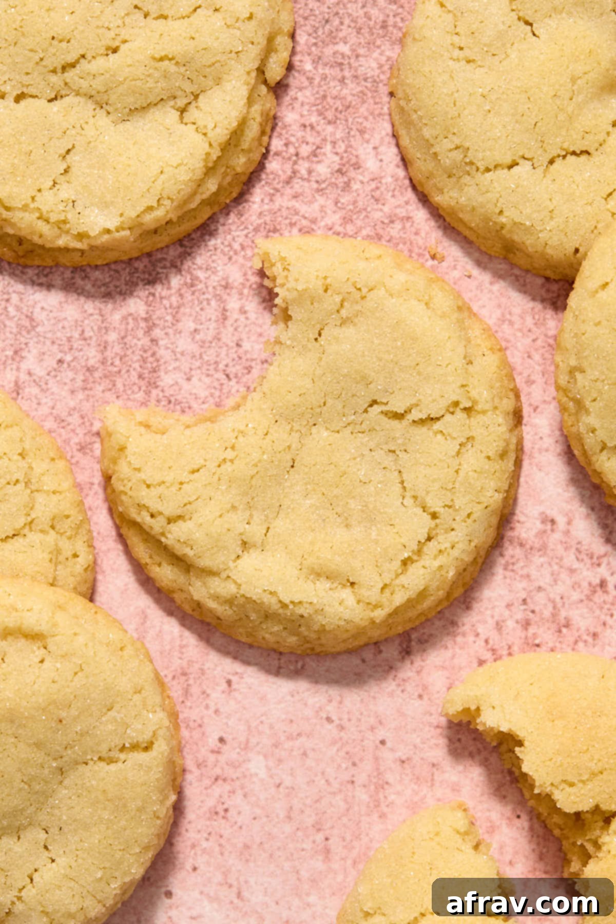 A delicious almond flour sugar cookie with a bite taken out of it, revealing its soft and chewy texture.