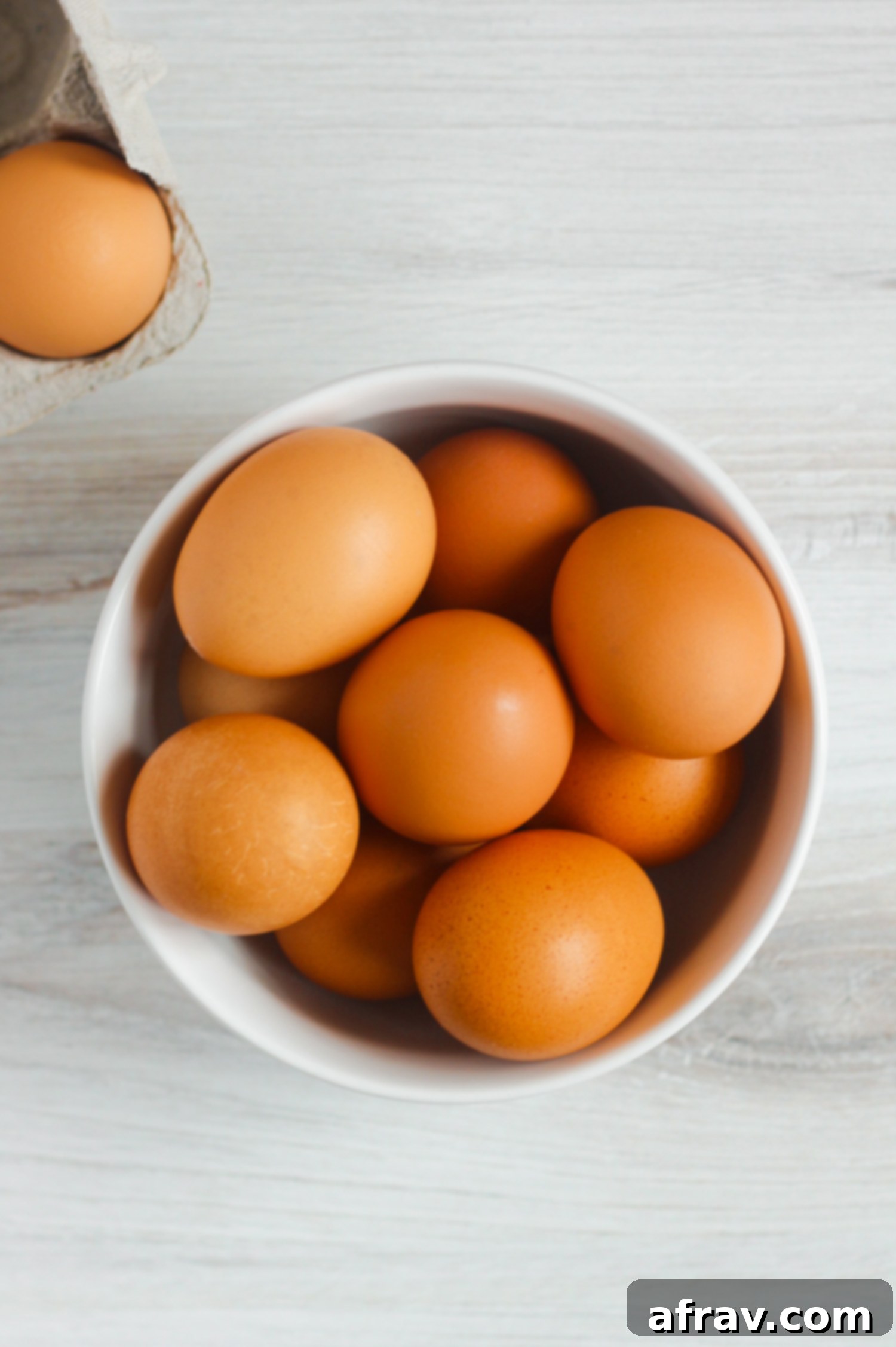 brown eggs in white bowl