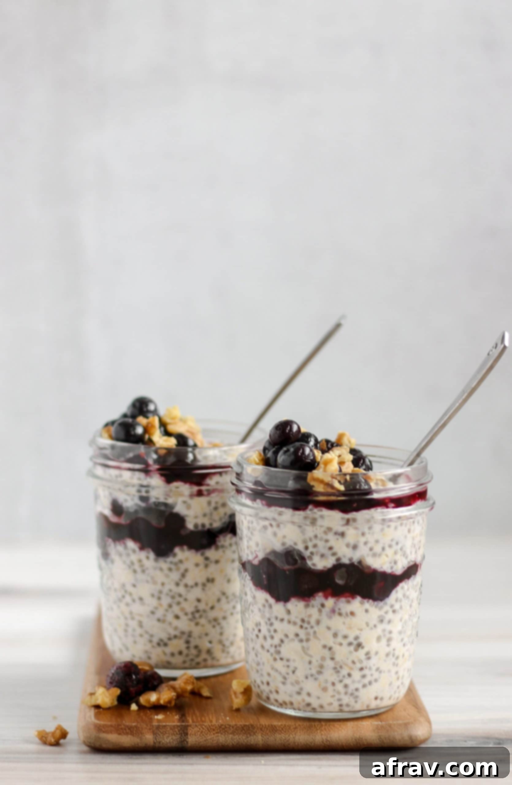 Overnight Blueberry Chia Oats 4 two mason jars filled with blueberry chia overnight oats
