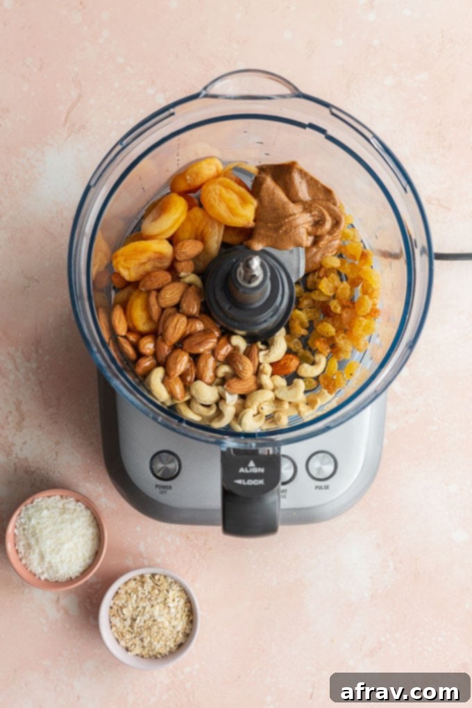 Wholesome Coconut Apricot Energy Bites 4 Ingredients to make apricot bliss balls in a food processor bowl.