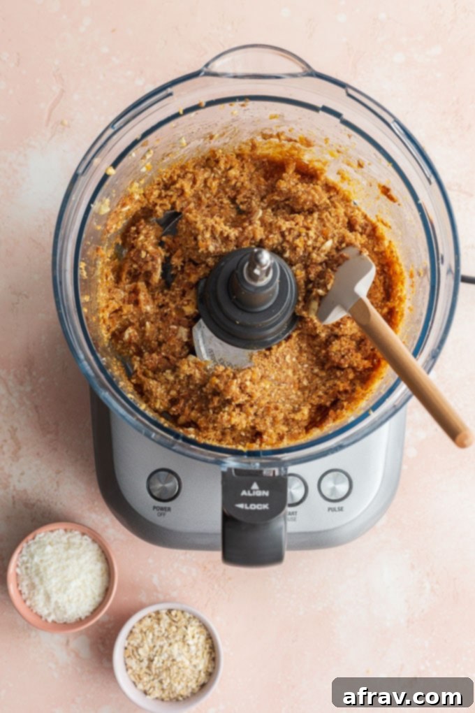 Wholesome Coconut Apricot Energy Bites 5 Mixture for the apricot balls blended together in a food processor bowl.