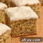 Double Sour Cream Banana Cake 13 Side view of sour cream banana cake arranged on brown parchment paper.