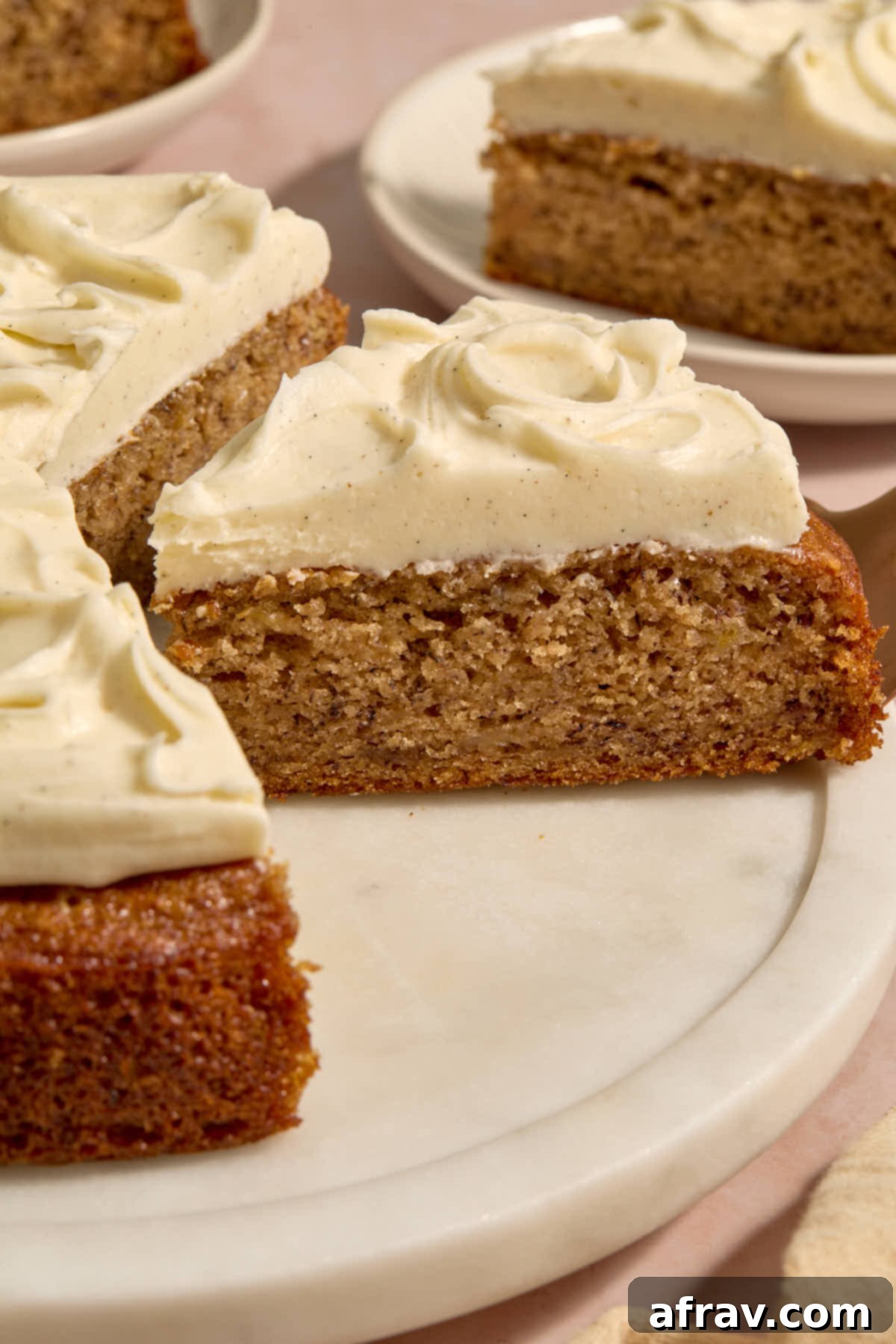 Side view of a slice of cake being removed from the cake platter.