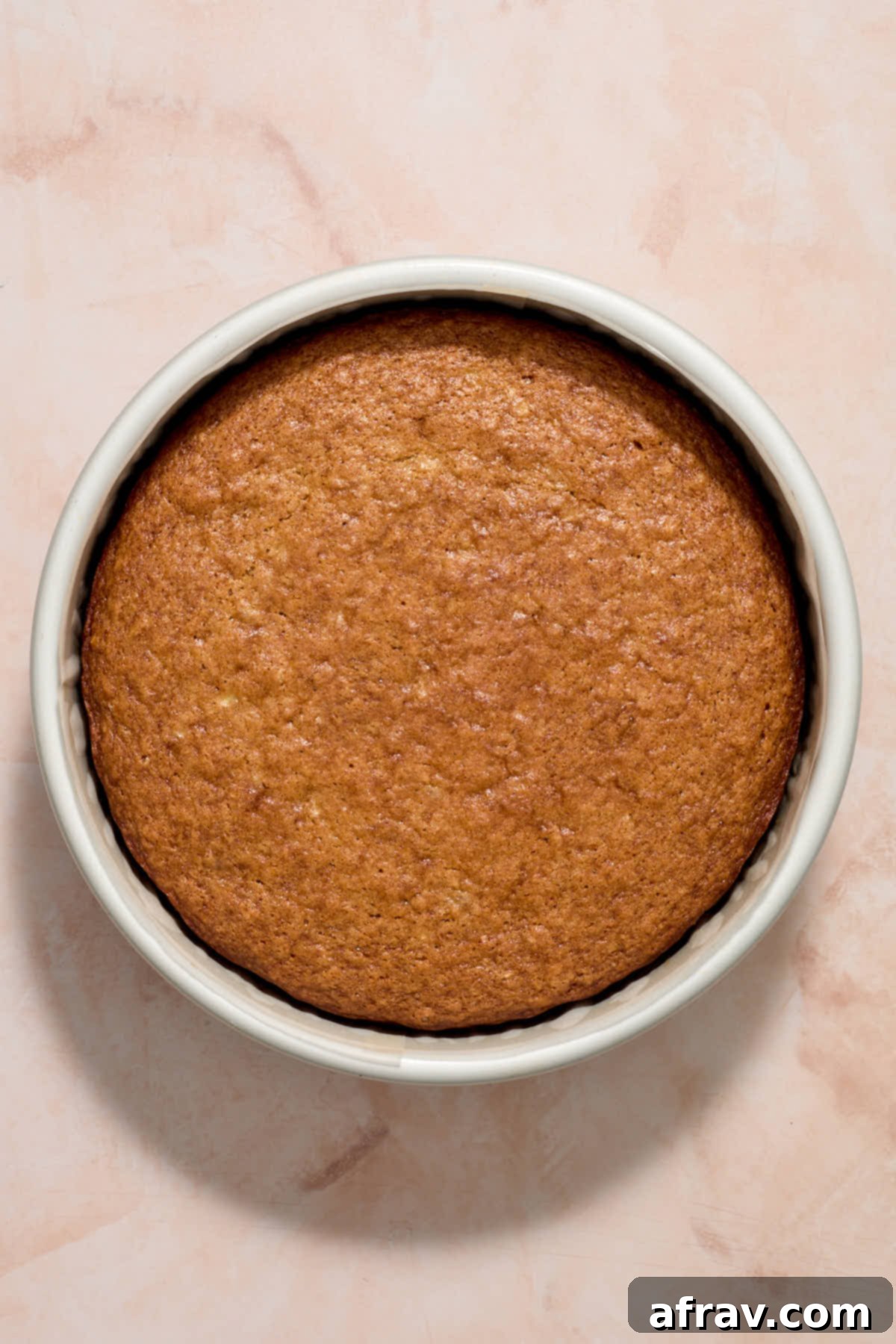 Cake baked in cake pan.